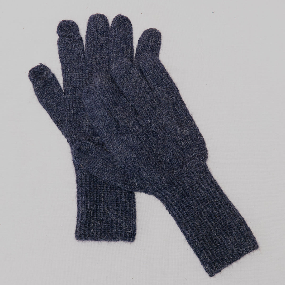 A pair of dark navy blue knit gloves