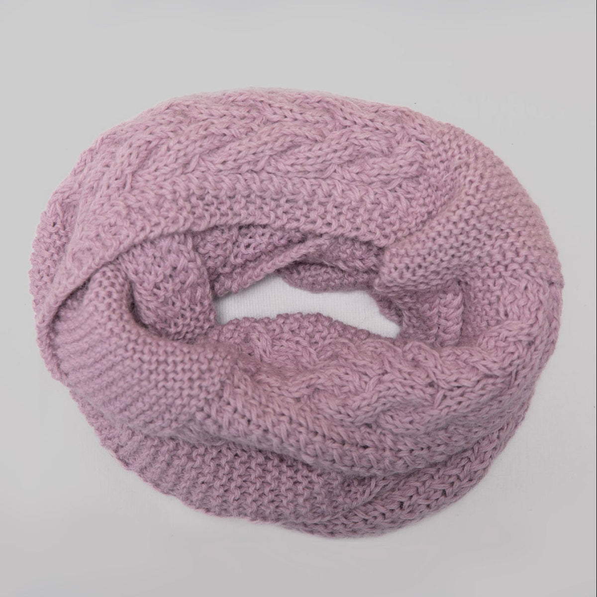 A dusty purple cable-knit infinity scarf
