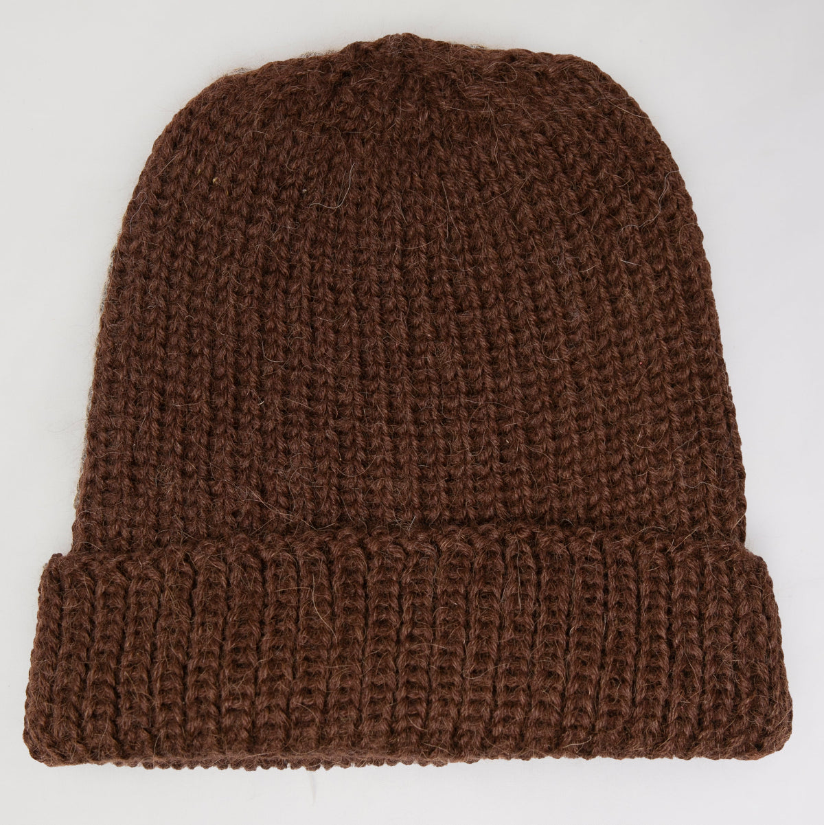 A brown ribbed knit beanie hat