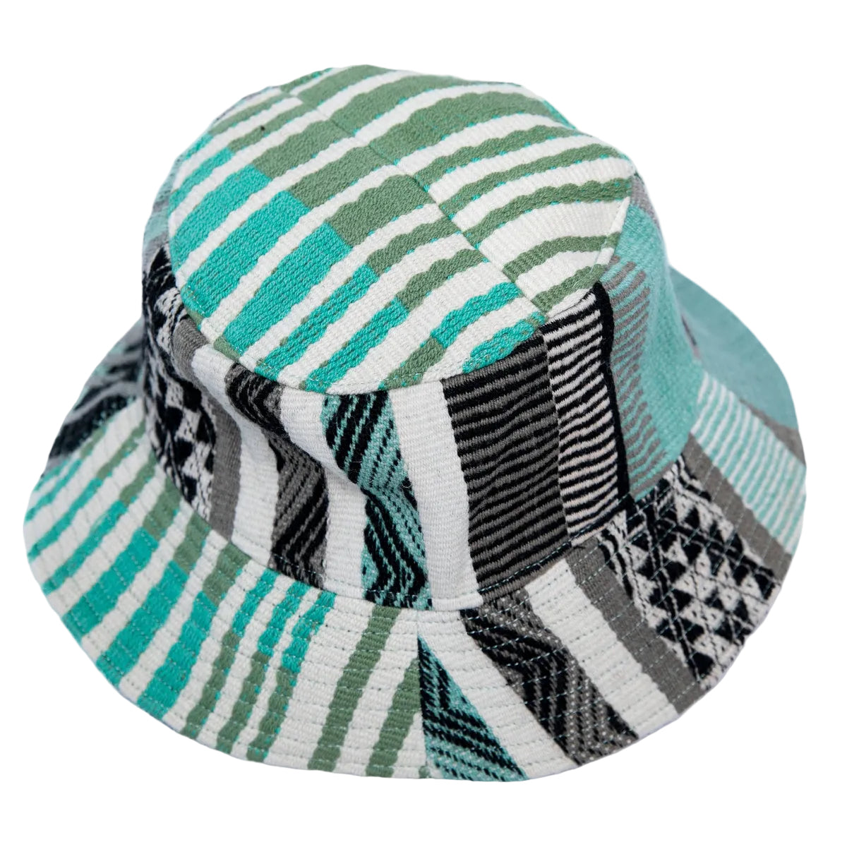 A bucket hat featuring a patchwork design with green, teal, black, and white geometric and striped patterns, set against a plain white background.