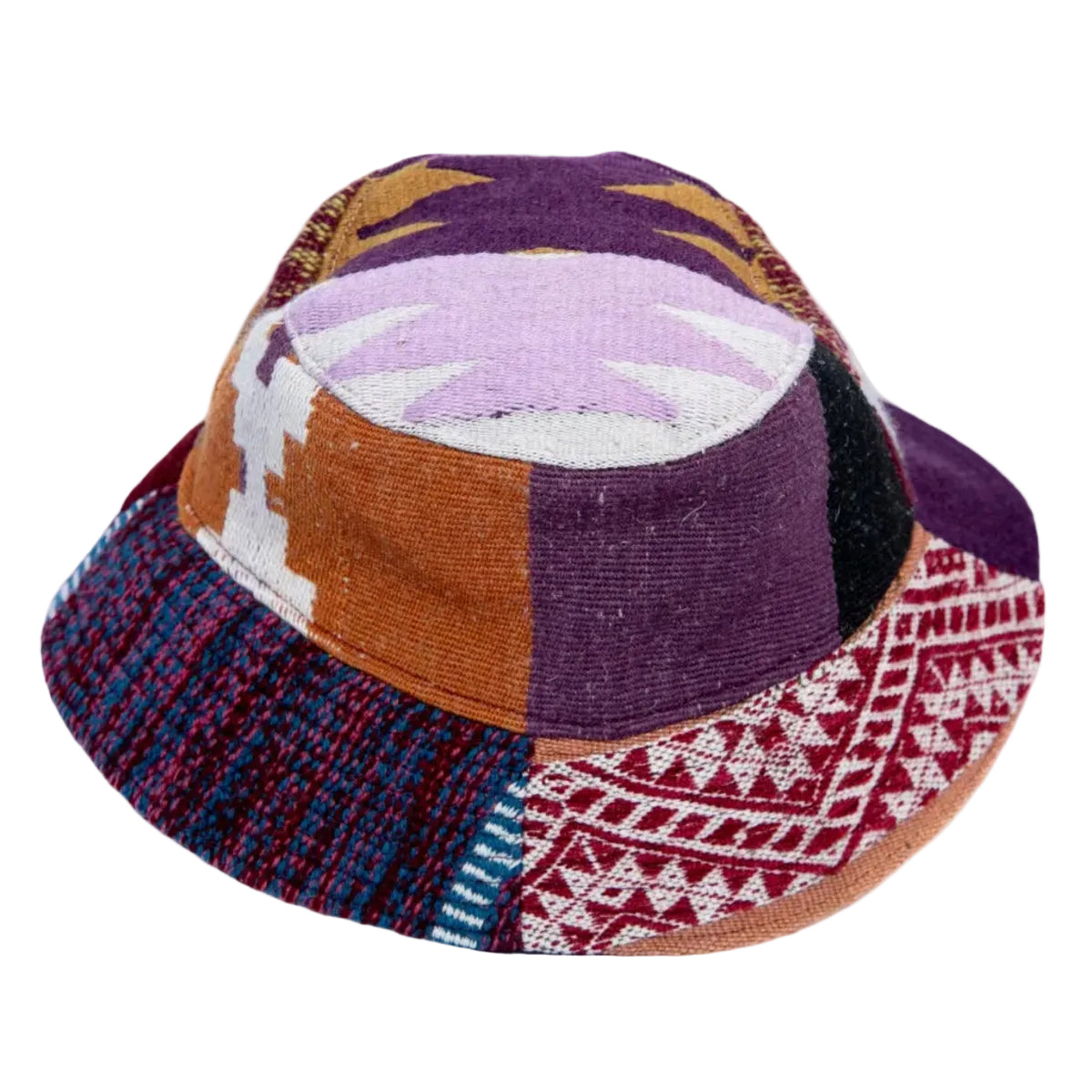 A handmade patchwork bucket hat featuring a variety of colorful woven and patterned fabric panels in purple, brown, red, blue, and white.