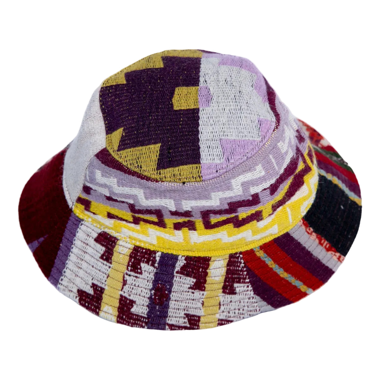A woven bucket hat with a multicolor geometric pattern featuring purple, yellow, red, white, and black threads.
